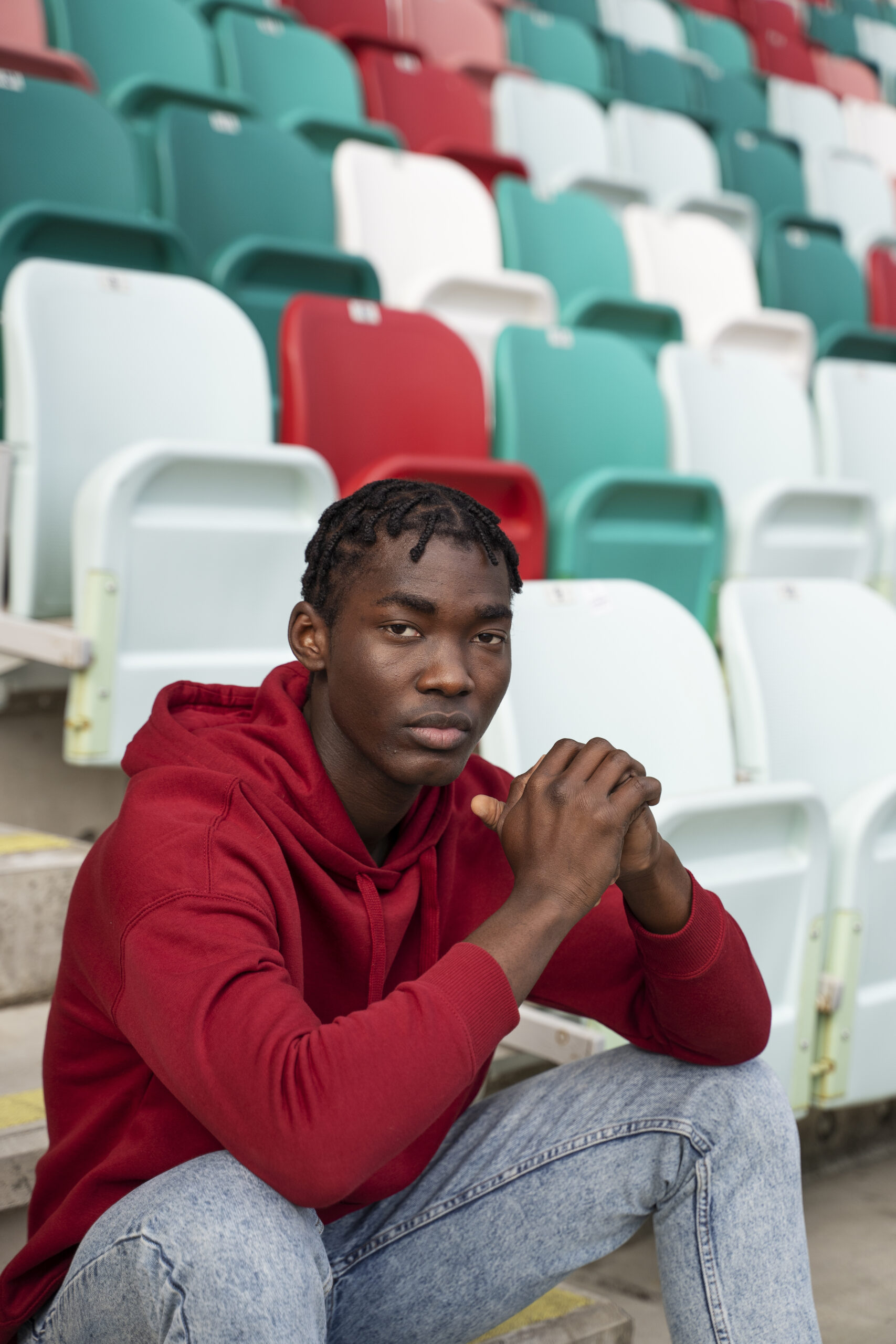 man sitting grandstands medium shot